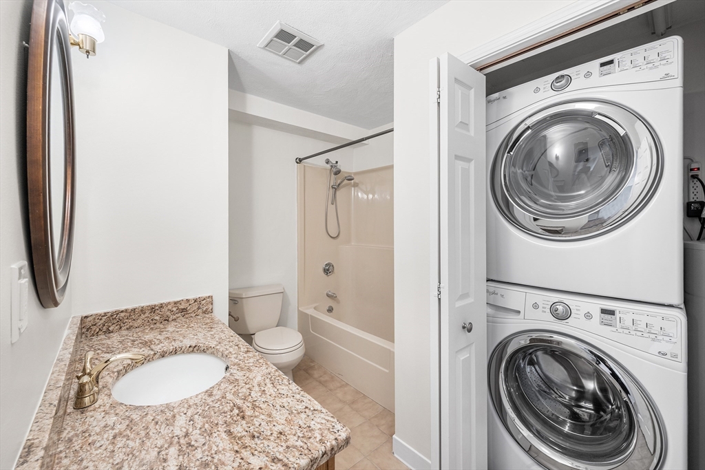 39 Parlin Street, Unit 503 Everett, MA 02149 - Photo 23 of 24 a bathroom with a toilet and a sink