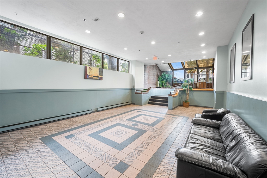 39 Parlin Street, Unit 503 Everett, MA 02149 - Photo 5 of 24 a living room with furniture and a rug