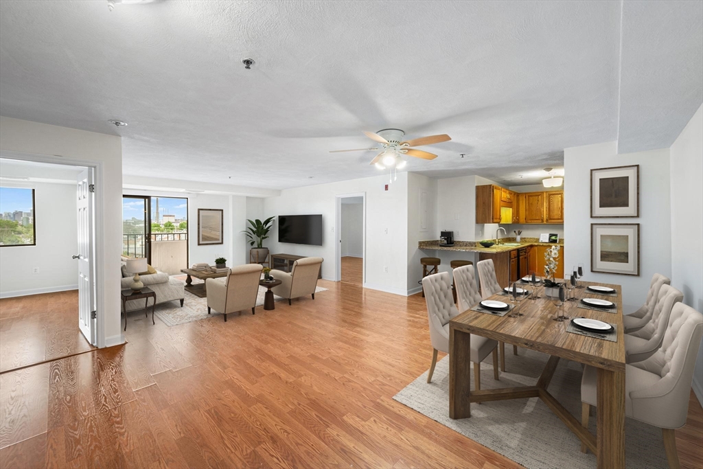 39 Parlin Street, Unit 503 Everett, MA 02149 - Photo 7 of 24 a living room with furniture and a flat screen tv