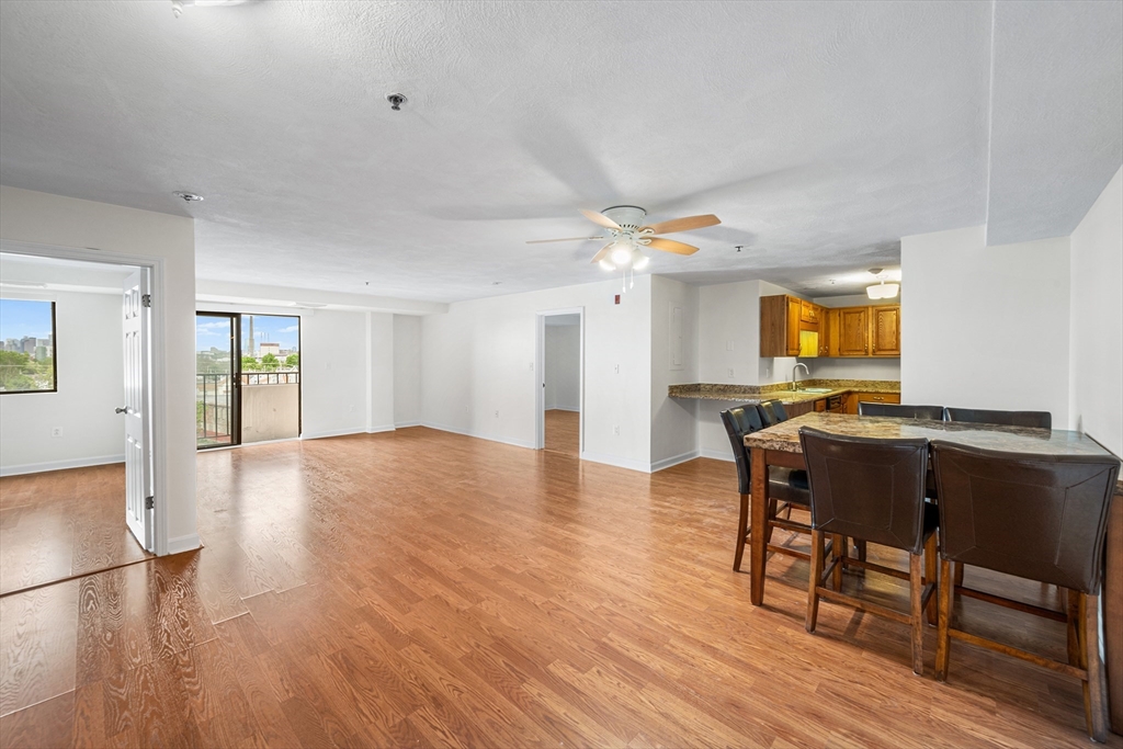 39 Parlin Street, Unit 503 Everett, MA 02149 - Photo 8 of 24 a view of a dining room with furniture and wooden floor