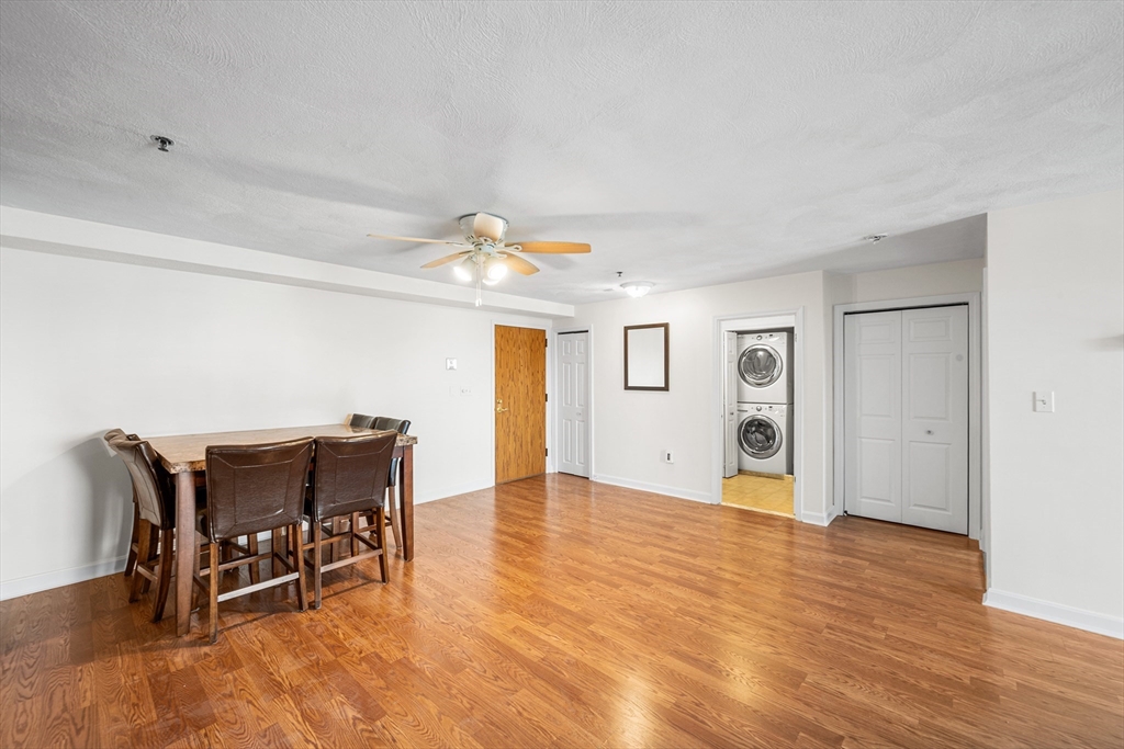 39 Parlin Street, Unit 503 Everett, MA 02149 - Photo 10 of 24 a view of a livingroom with furniture and a dining table
