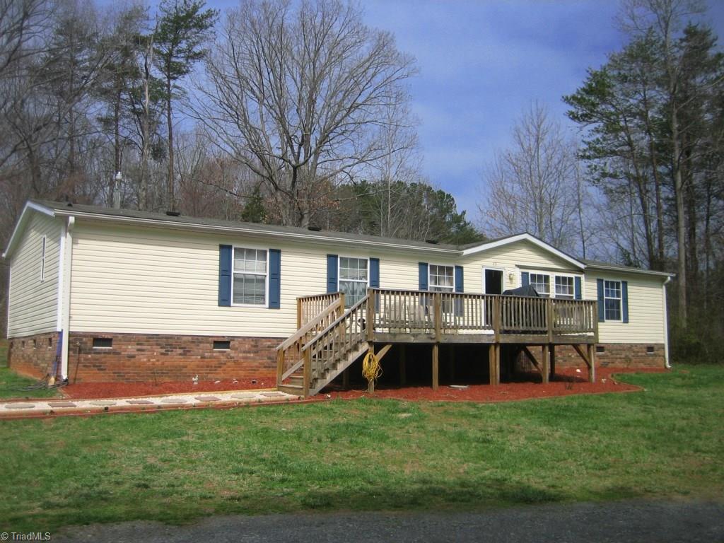 Front view of home. Large 10x20 deck. Landscaped.