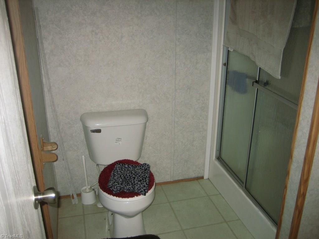 4738 Roundleaf Road Ramseur, NC 27316 - Photo 7 of 19 His side of the Jack & Jill bath in the master.