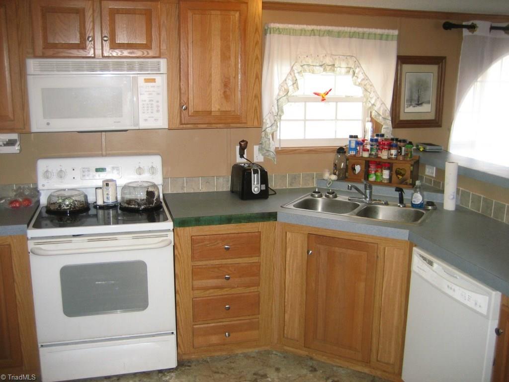 4738 Roundleaf Road Ramseur, NC 27316 - Photo 10 of 19 View of the kitchen from the dining room side.