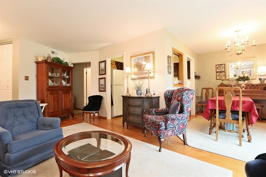 Undisclosed Address Wheaton, IL 60189 - Photo 3 of 10 a living room with furniture and a fireplace