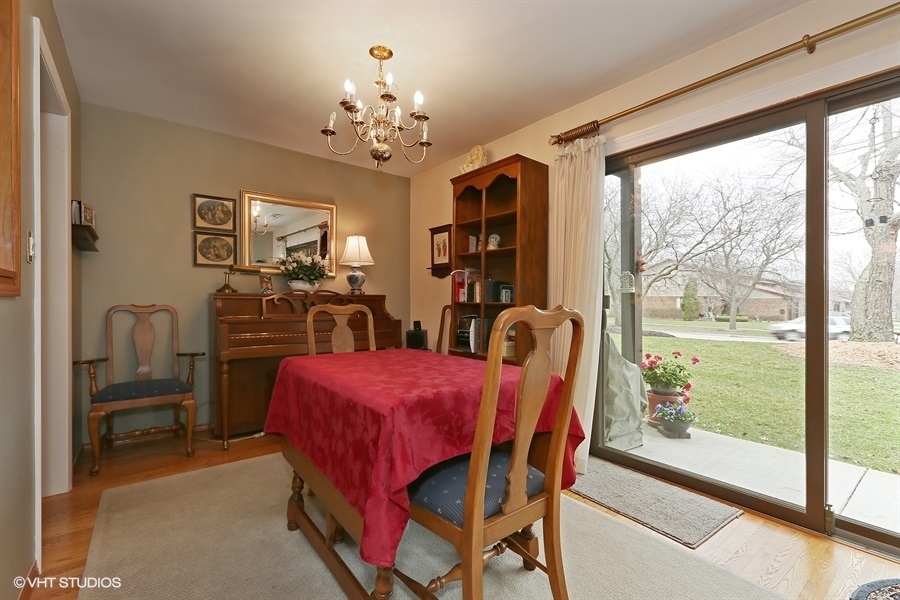 Undisclosed Address Wheaton, IL 60189 - Photo 5 of 10 a dining room with furniture a chandelier and a large window
