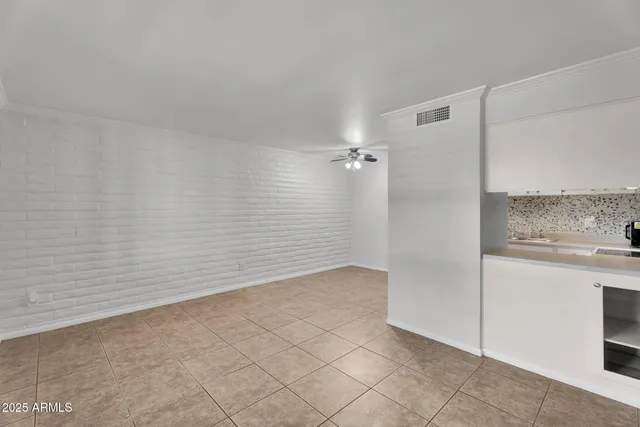 a view of a livingroom with a ceiling fan and a rug