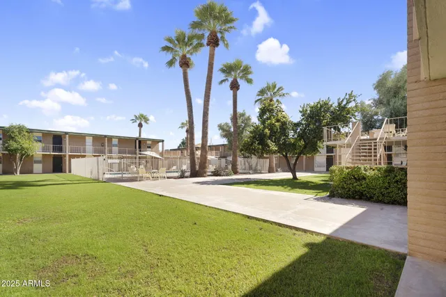 a view of a swimming pool with a table and chairs