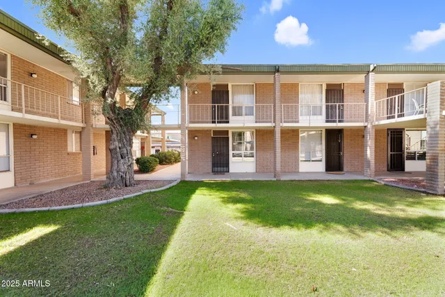a view of an house with backyard porch and furniture