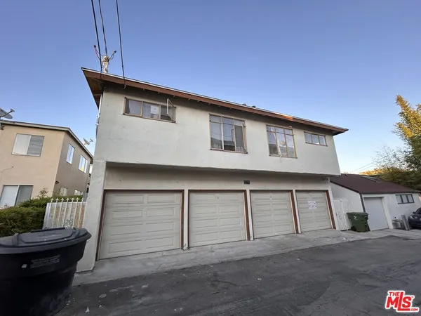 a front view of a house with a garage