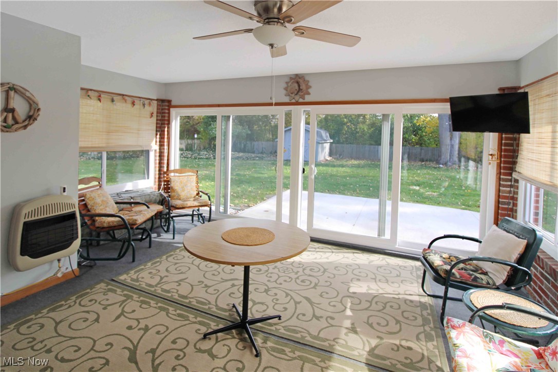 2708 East Sand Road Port Clinton, OH 43452 - Photo 19 of 33 Sunroom with a healthy amount of sunlight, heating unit, and ceiling fan