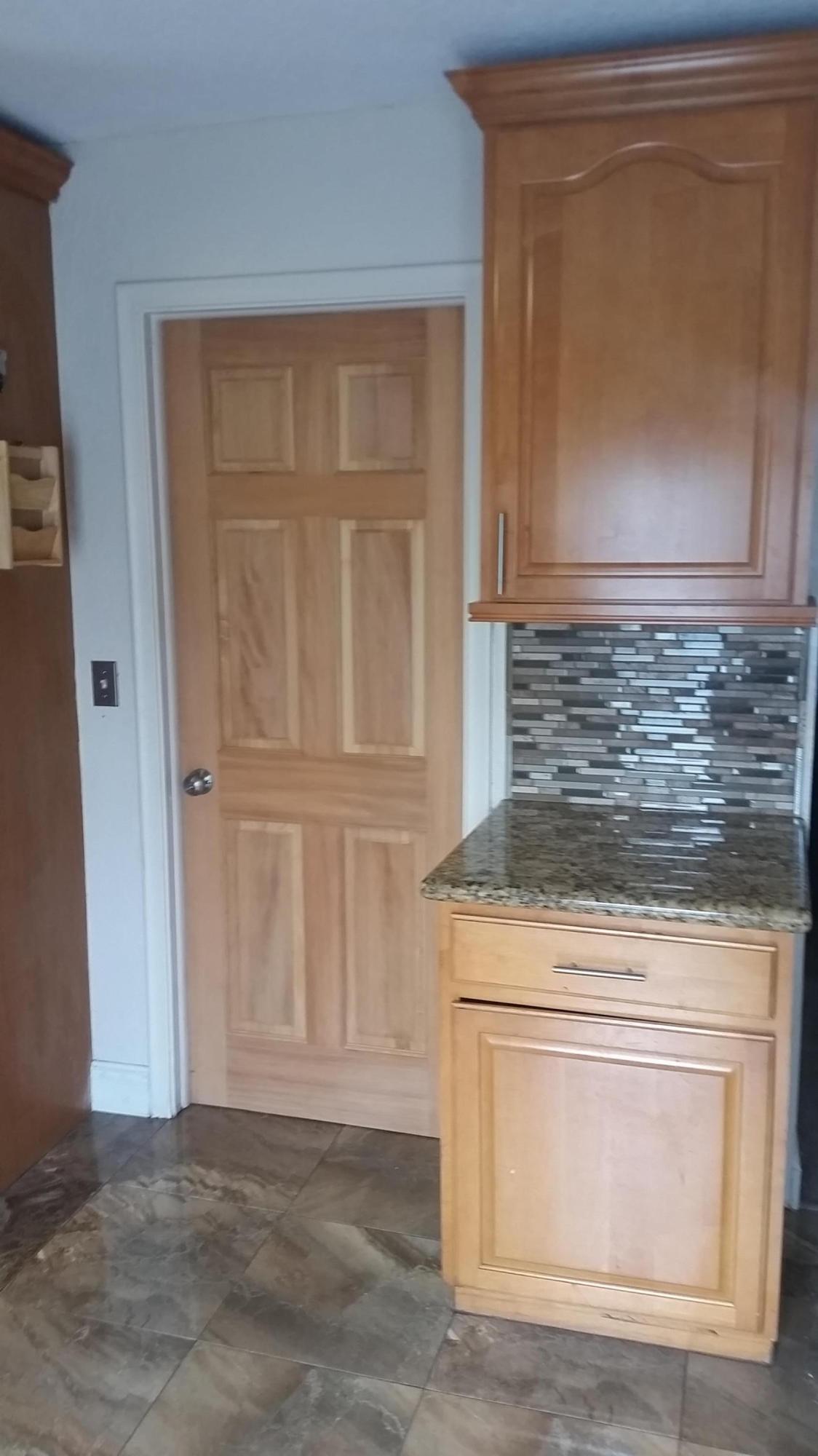 4693 Bison Street Boca Raton, FL 33428 - Photo 14 of 34 a stove top oven sitting inside of a kitchen