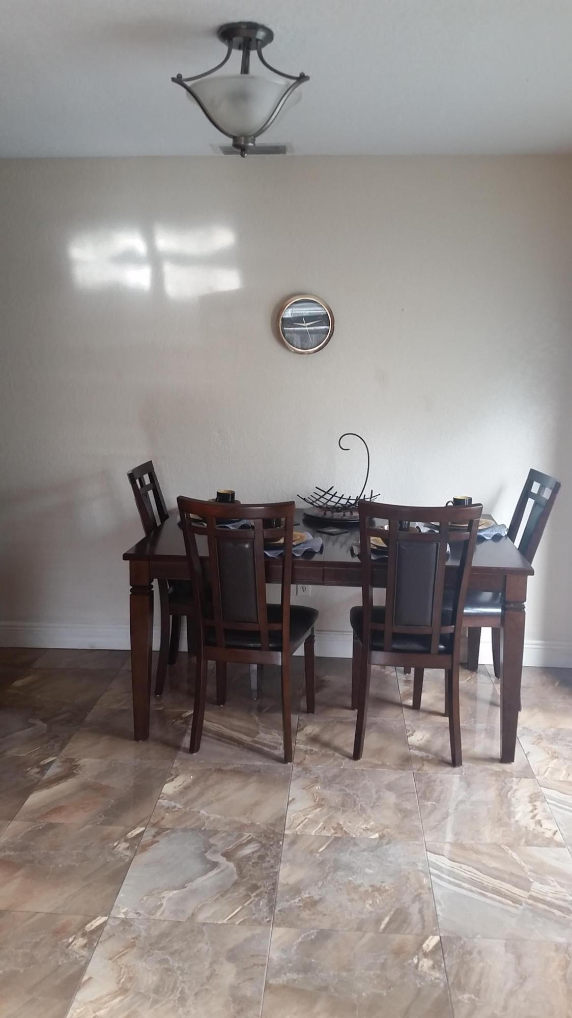 4693 Bison Street Boca Raton, FL 33428 - Photo 15 of 34 a view of a dining room with furniture