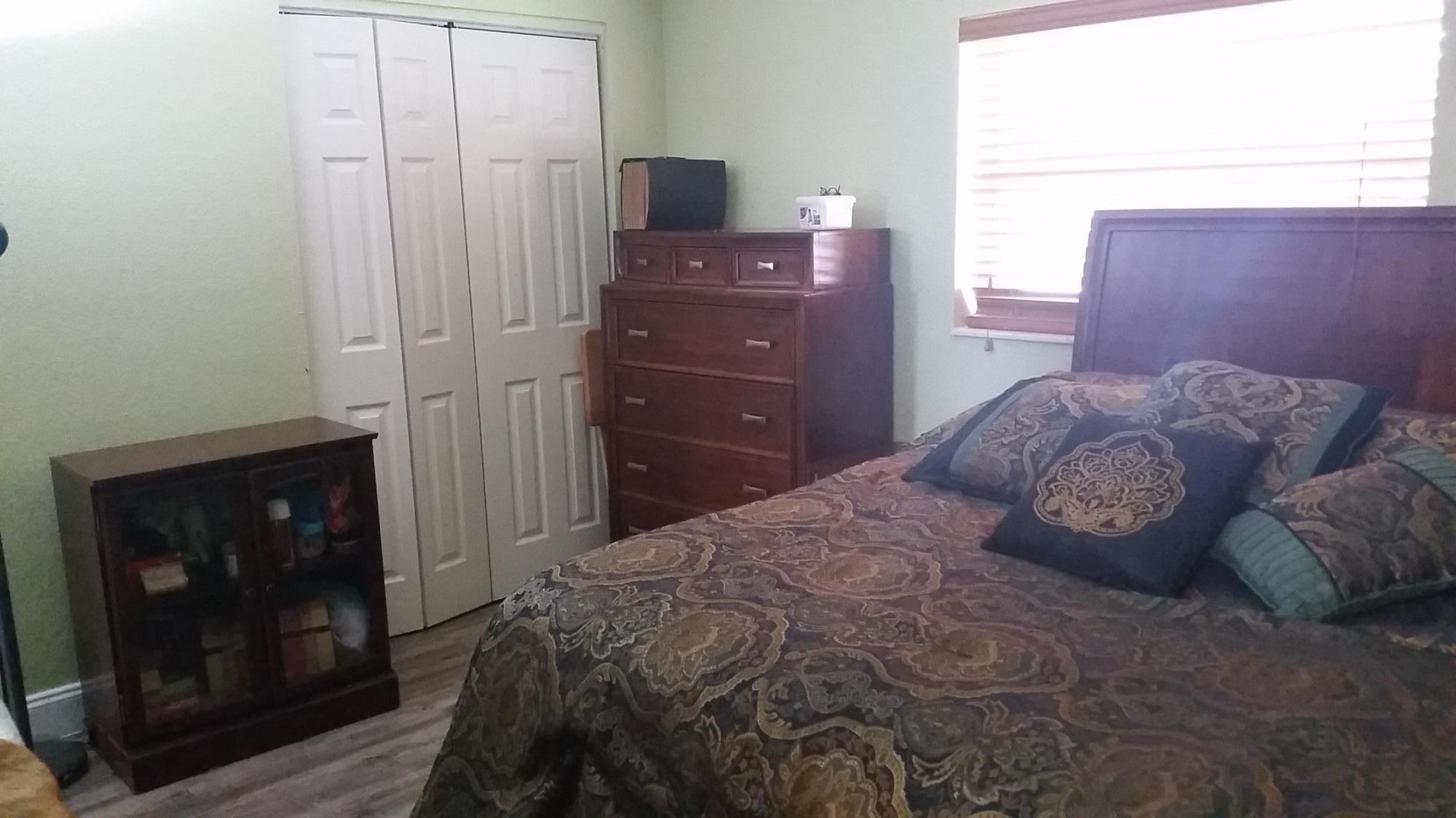4693 Bison Street Boca Raton, FL 33428 - Photo 17 of 34 a bedroom with a bed and a dresser