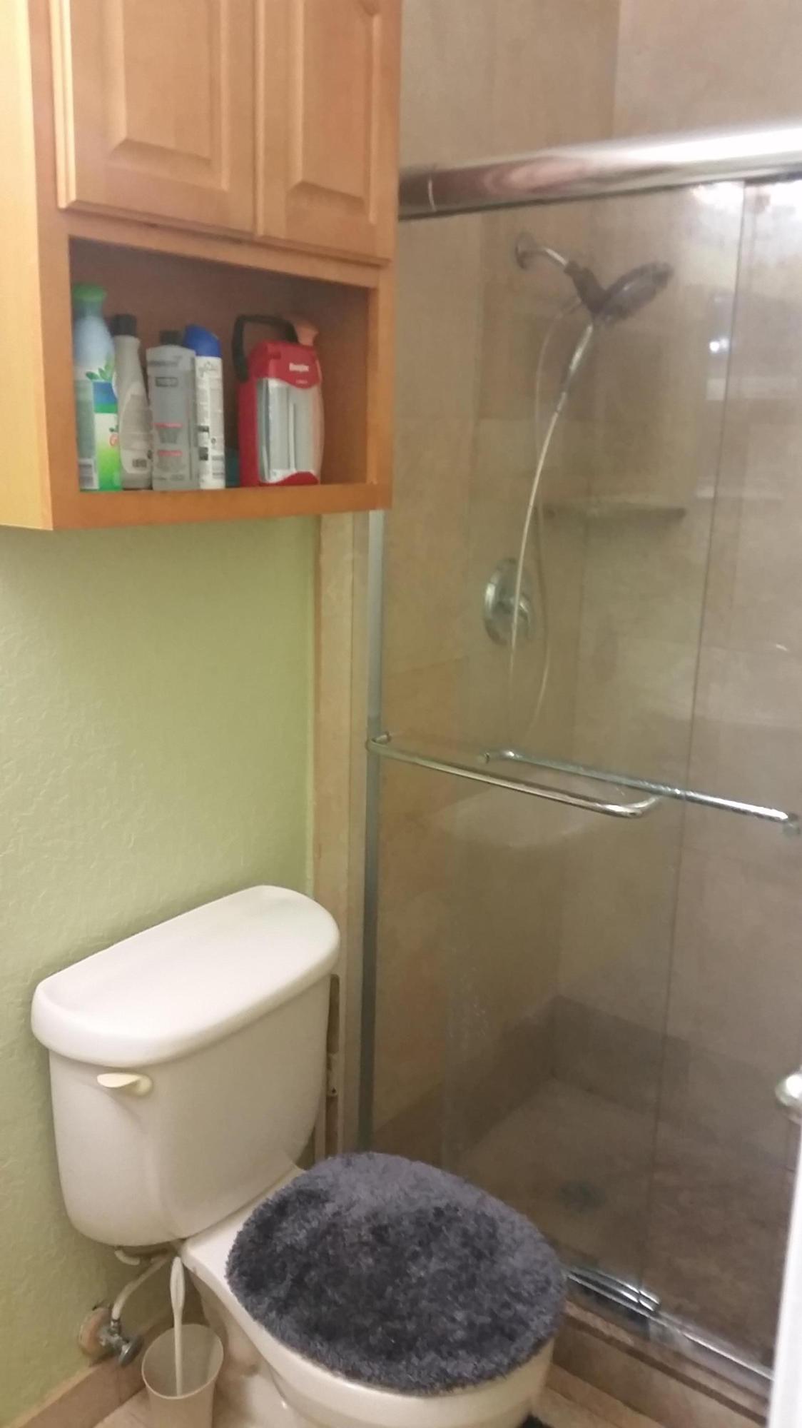 4693 Bison Street Boca Raton, FL 33428 - Photo 20 of 34 a bathroom with a toilet and a shower