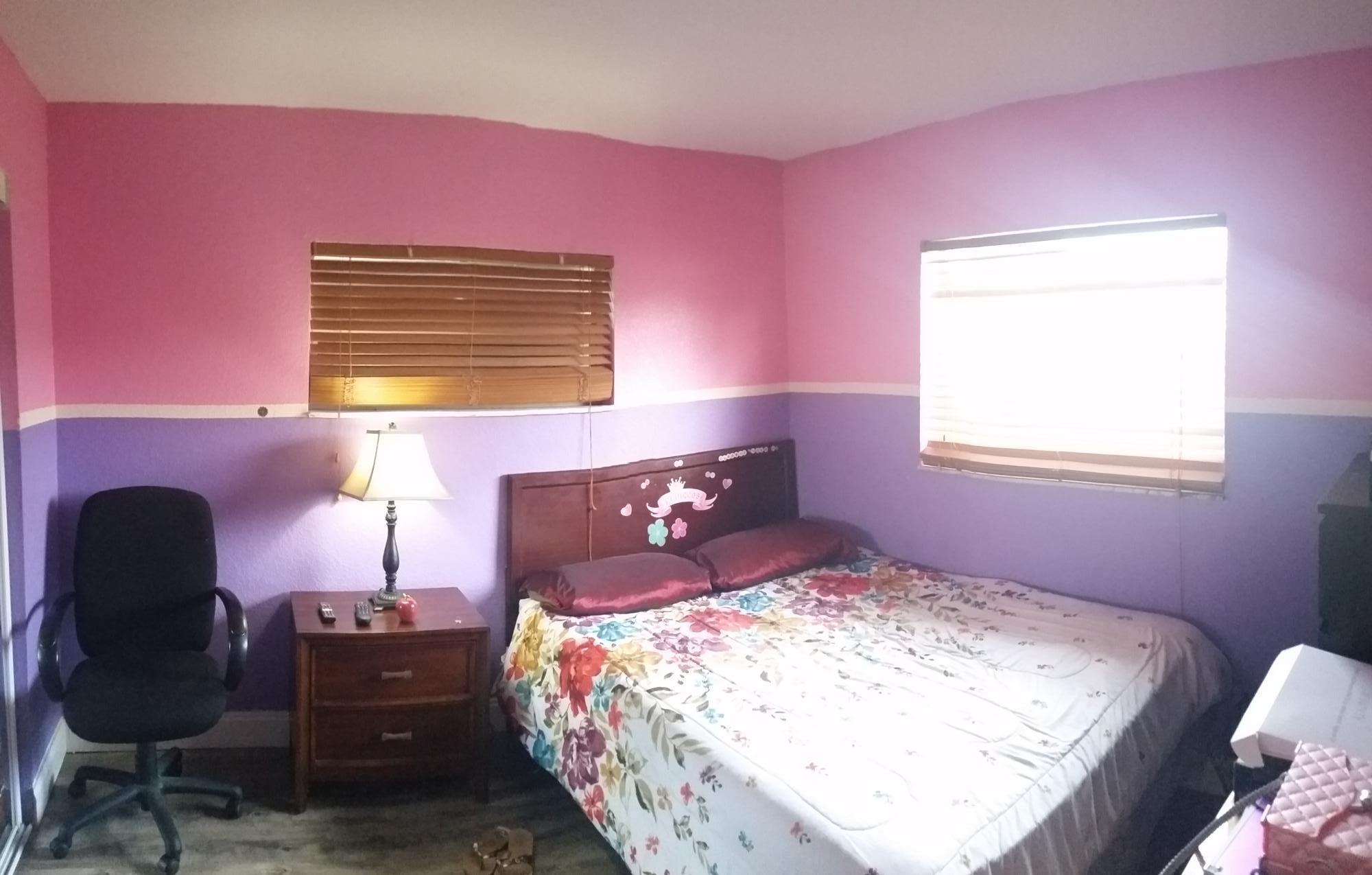 4693 Bison Street Boca Raton, FL 33428 - Photo 24 of 34 a bedroom with a bed and a chair