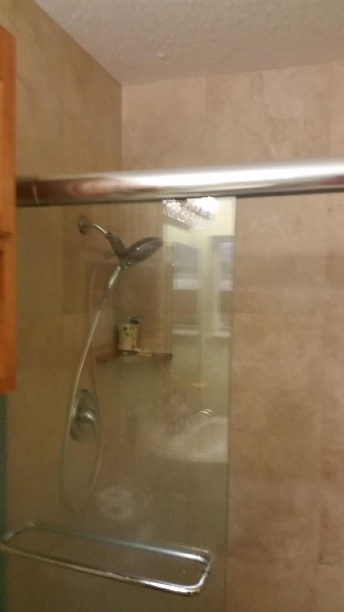 4693 Bison Street Boca Raton, FL 33428 - Photo 30 of 34 a bathroom with a shower