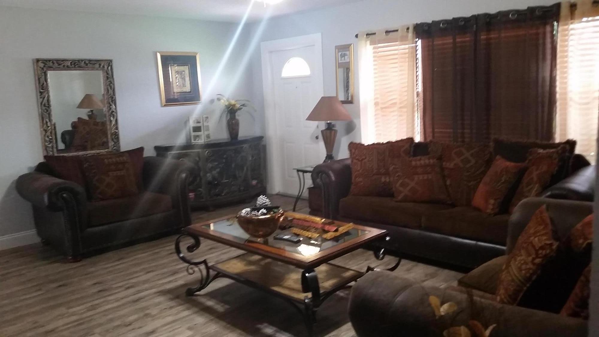 4693 Bison Street Boca Raton, FL 33428 - Photo 8 of 34 a living room with furniture and a window