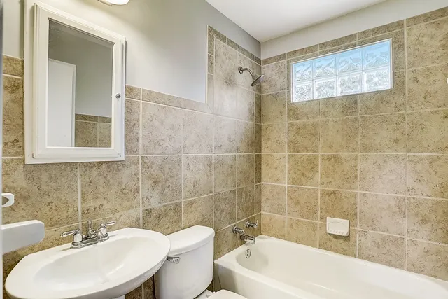 an empty room with wooden floor and closet