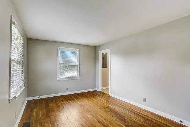 a view of backyard with deck and garden