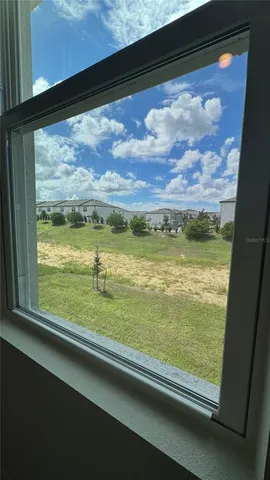 an empty room with a empty space and windows