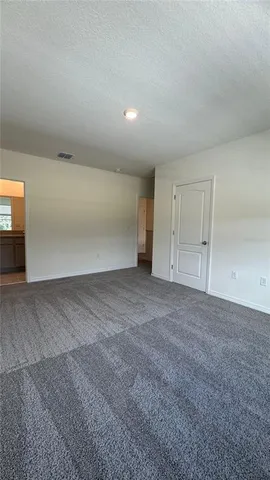 a bathroom with a granite countertop sink mirror and toilet