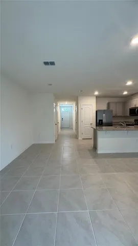 a view of a kitchen with a sink and a stove top oven