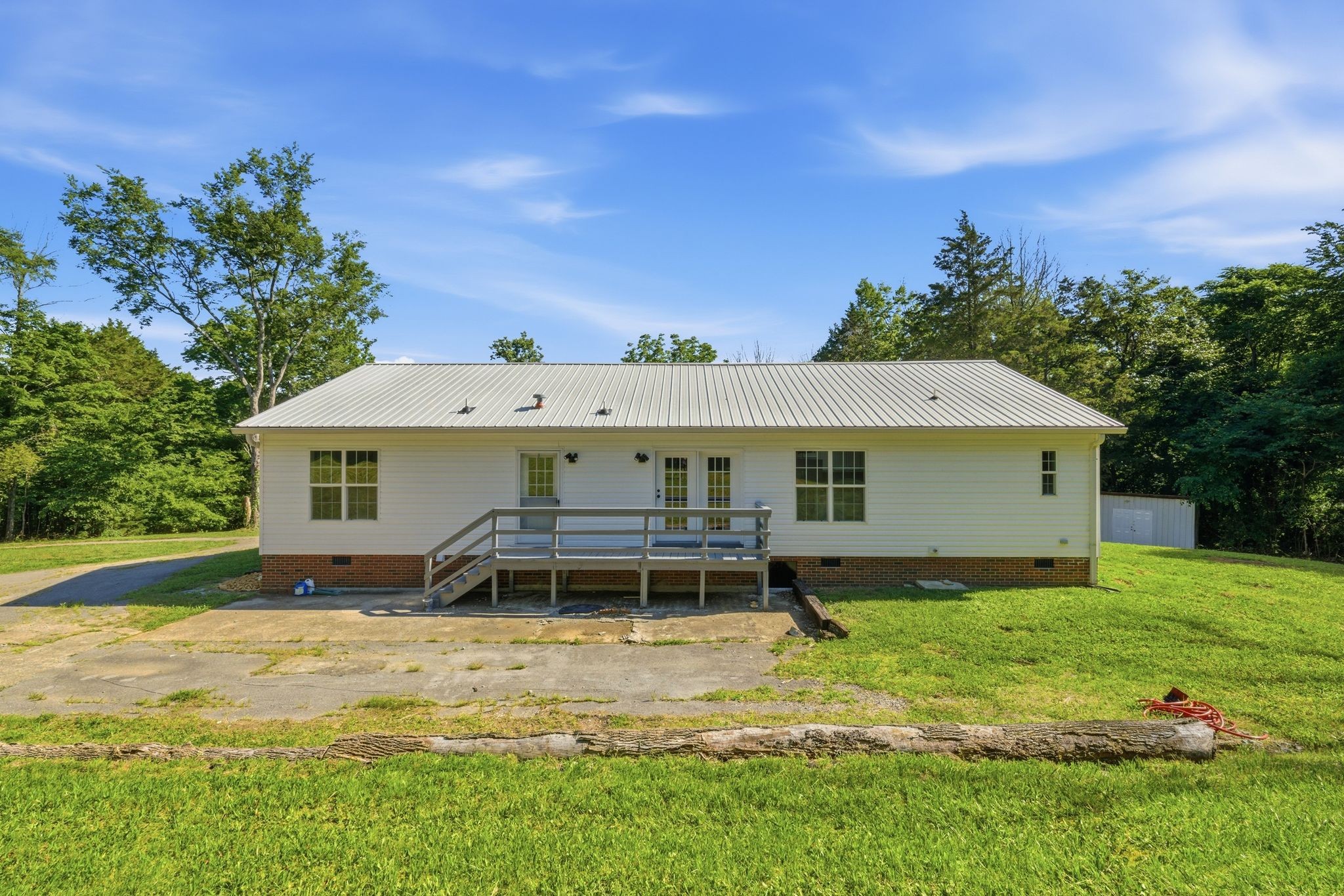 1021 B Jordan Road Lascassas, TN 37085 - Photo 48 of 58 a view of a house with pool and a garden