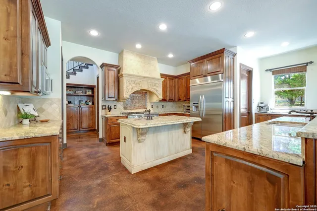 a bathroom with a double vanity sink mirror and shower