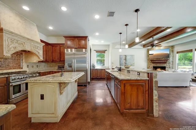 a dining room with furniture a fireplace and wooden floor