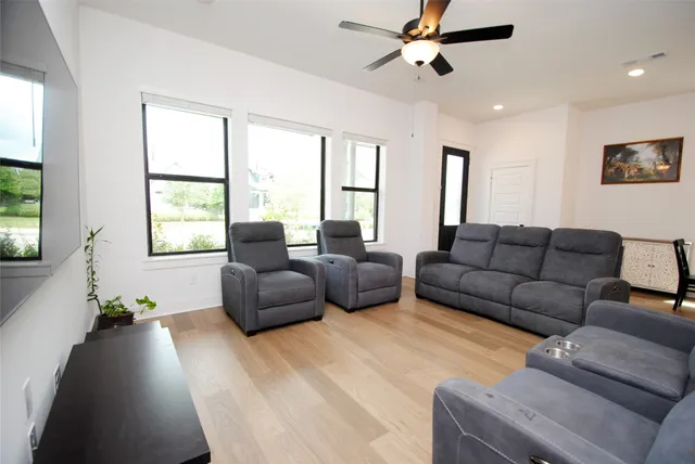 a kitchen with kitchen island granite countertop a sink counter and chairs