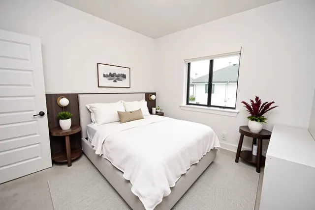 a bedroom with a bed and a couch