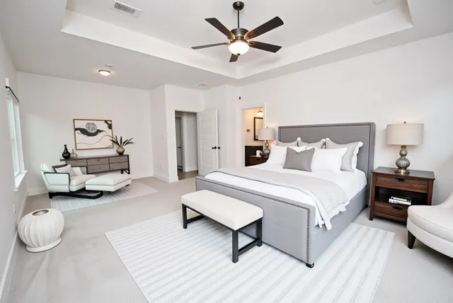 a view of a backyard with table and chairs potted plants
