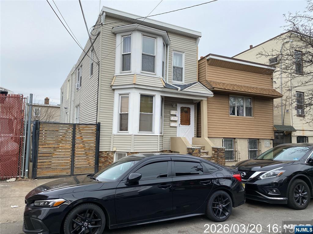 38 Delancy Street, Unit 3 Newark, NJ 07105 - Photo 2 of 16 a front view of a house with parking space