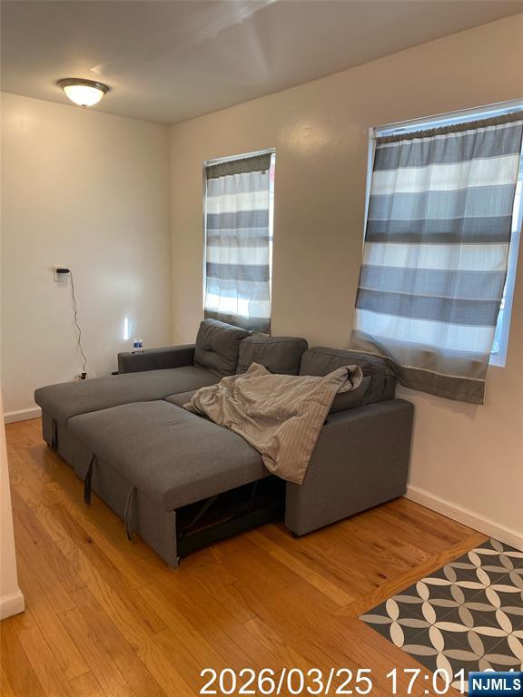 38 Delancy Street, Unit 3 Newark, NJ 07105 - Photo 8 of 16 a bedroom with a bed and a window