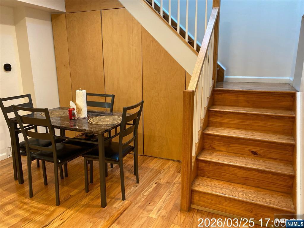 38 Delancy Street, Unit 3 Newark, NJ 07105 - Photo 10 of 16 a view of a dining room with furniture and wooden floor