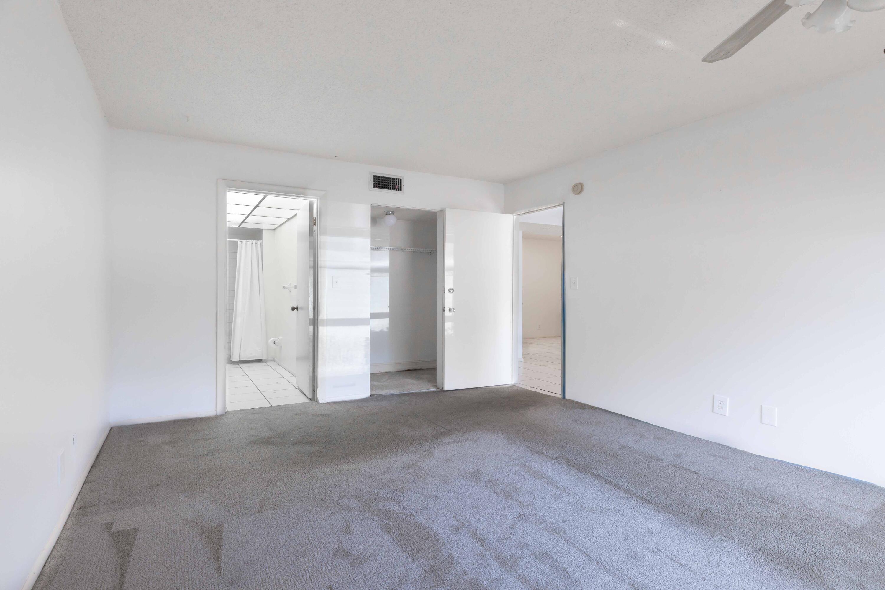 490 Northwest 20th Street, Unit 1050 Boca Raton, FL 33431 - Photo 14 of 23 Primary Bedroom