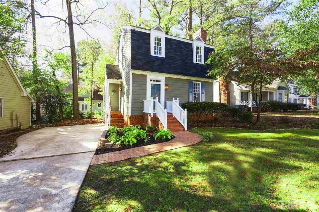 4417 Lancashire Drive Raleigh, NC 27613 - Photo 1 of 30 a front view of a house with garden