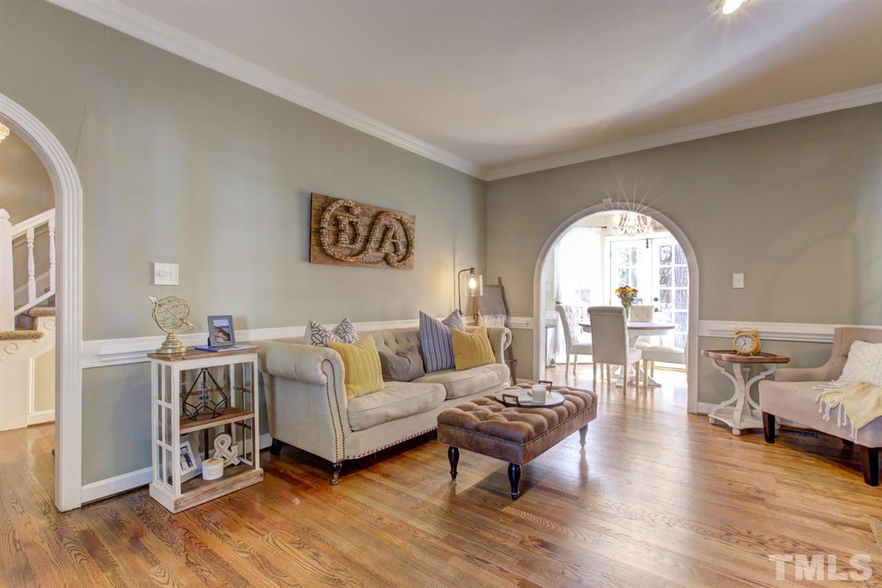 4417 Lancashire Drive Raleigh, NC 27613 - Photo 11 of 30 a living room with furniture and a wooden floor