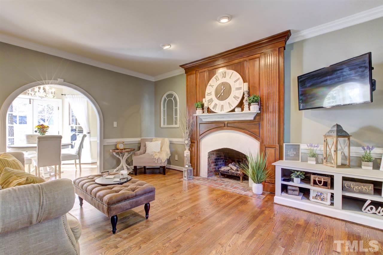 4417 Lancashire Drive Raleigh, NC 27613 - Photo 12 of 30 a living room with furniture and a fireplace