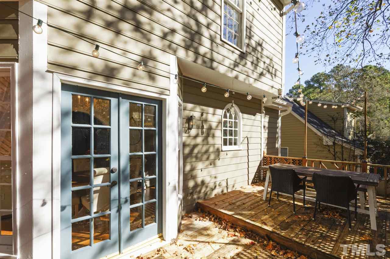 4417 Lancashire Drive Raleigh, NC 27613 - Photo 22 of 30 a front view of a building with a glass door