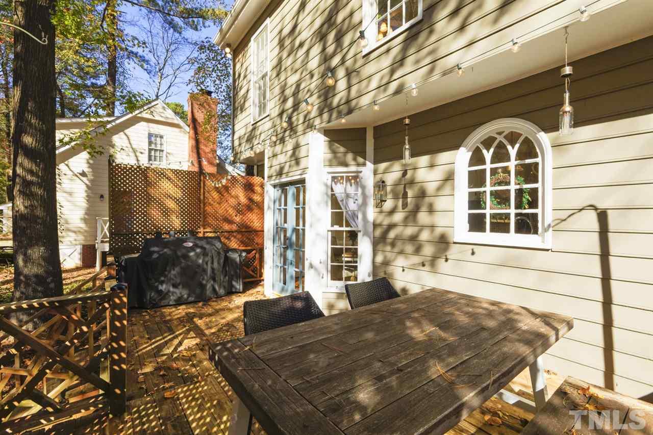 4417 Lancashire Drive Raleigh, NC 27613 - Photo 23 of 30 a view of a building with a outdoor space