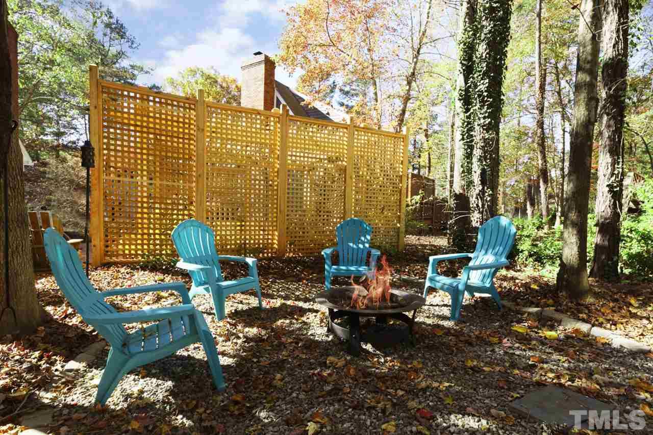 4417 Lancashire Drive Raleigh, NC 27613 - Photo 25 of 30 a view of a patio with chairs