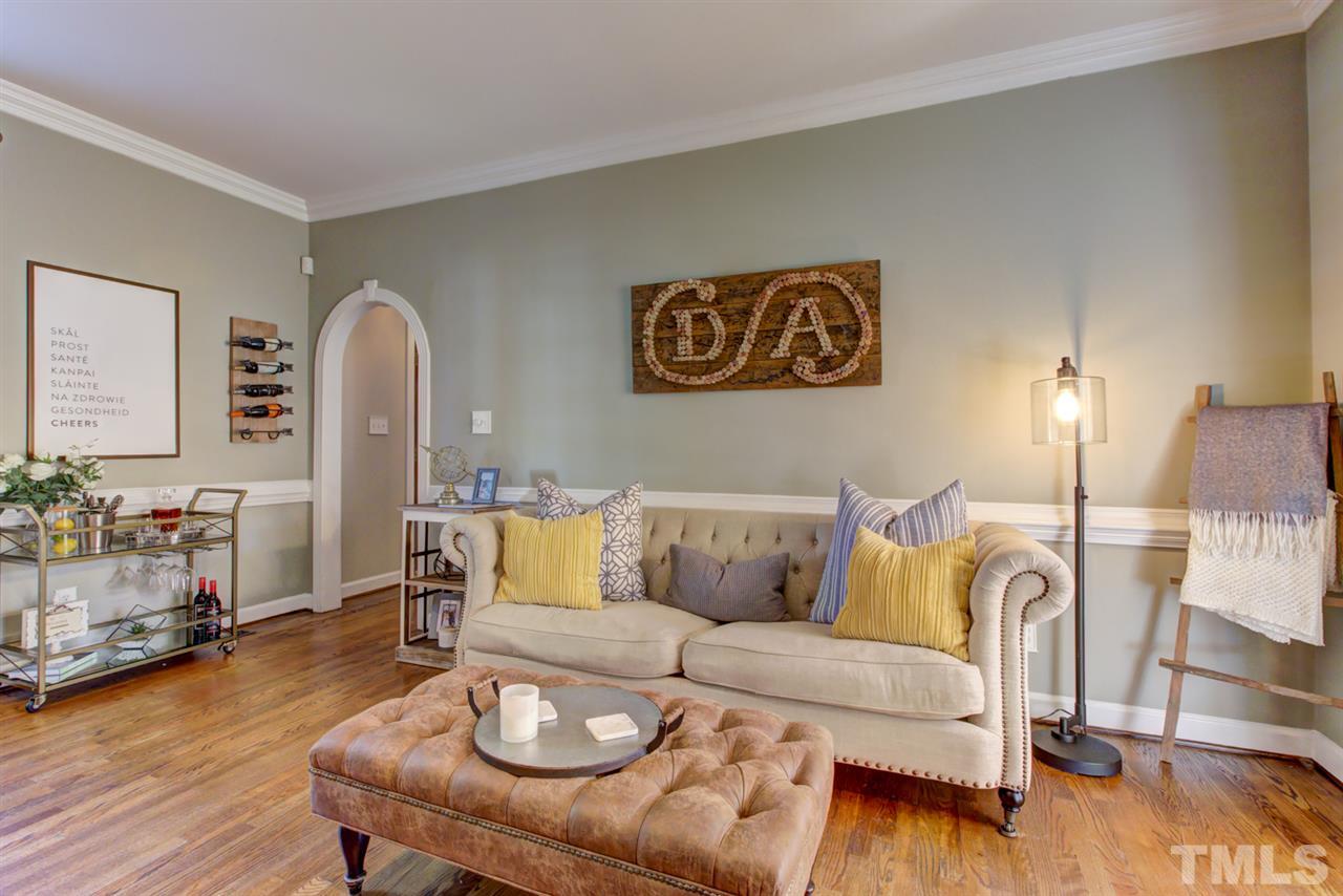 4417 Lancashire Drive Raleigh, NC 27613 - Photo 10 of 30 a living room with furniture and a wooden floor