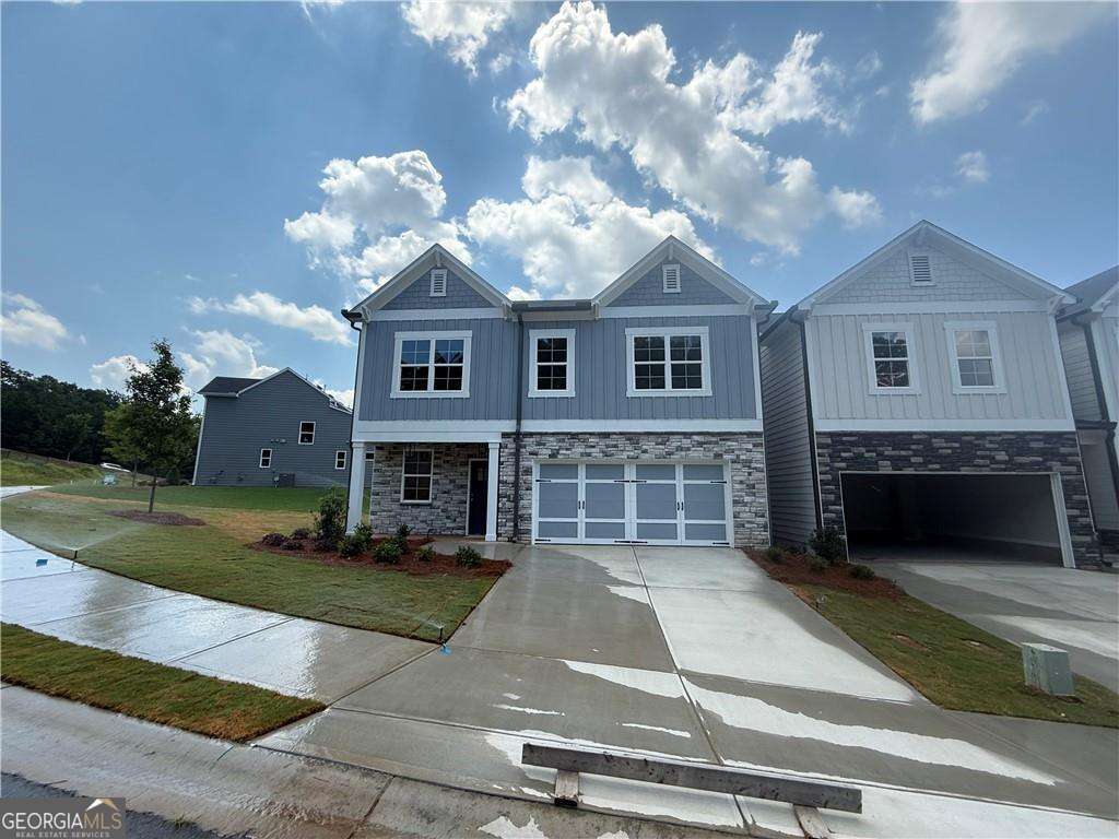 352 Lakeside Drive Canton, GA 30115 - Photo 2 of 16 a view of a brick house with a yard