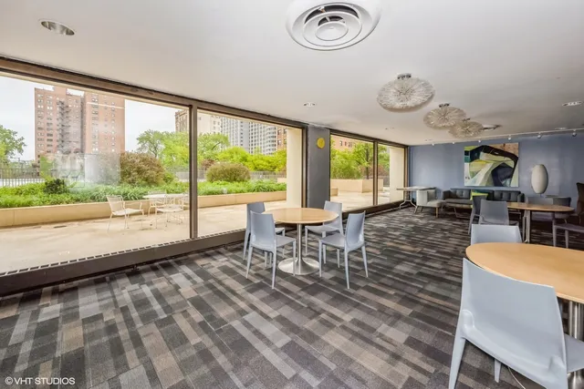 a view of a dining room with furniture window and outside view