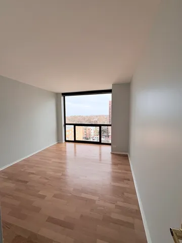 a view of an empty room with a window