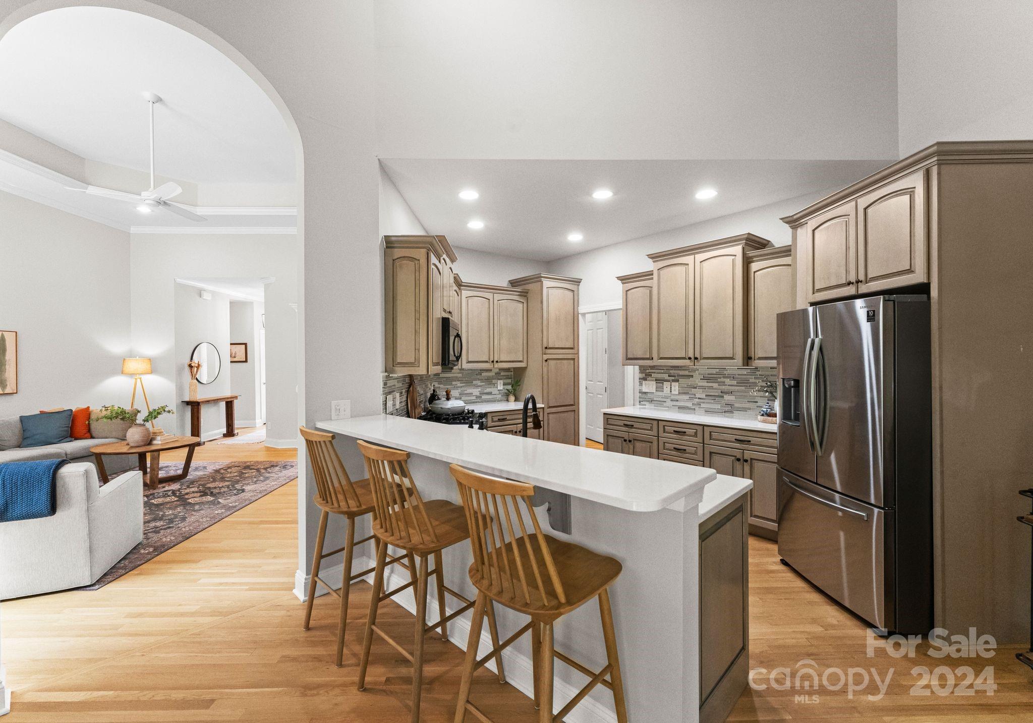 687 Normandy Road Mooresville, NC 28117 - Photo 14 of 32 a large kitchen with a table and chairs