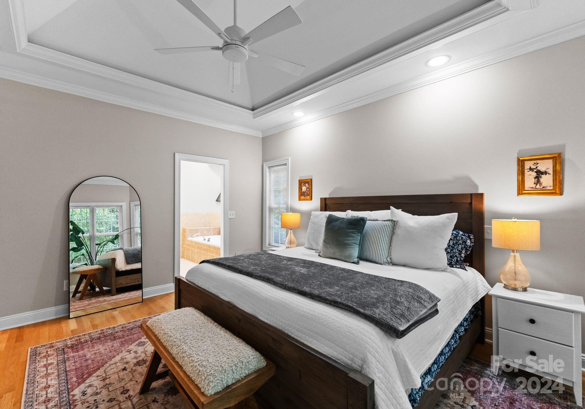 687 Normandy Road Mooresville, NC 28117 - Photo 19 of 32 a bedroom with double bed and a potted plant