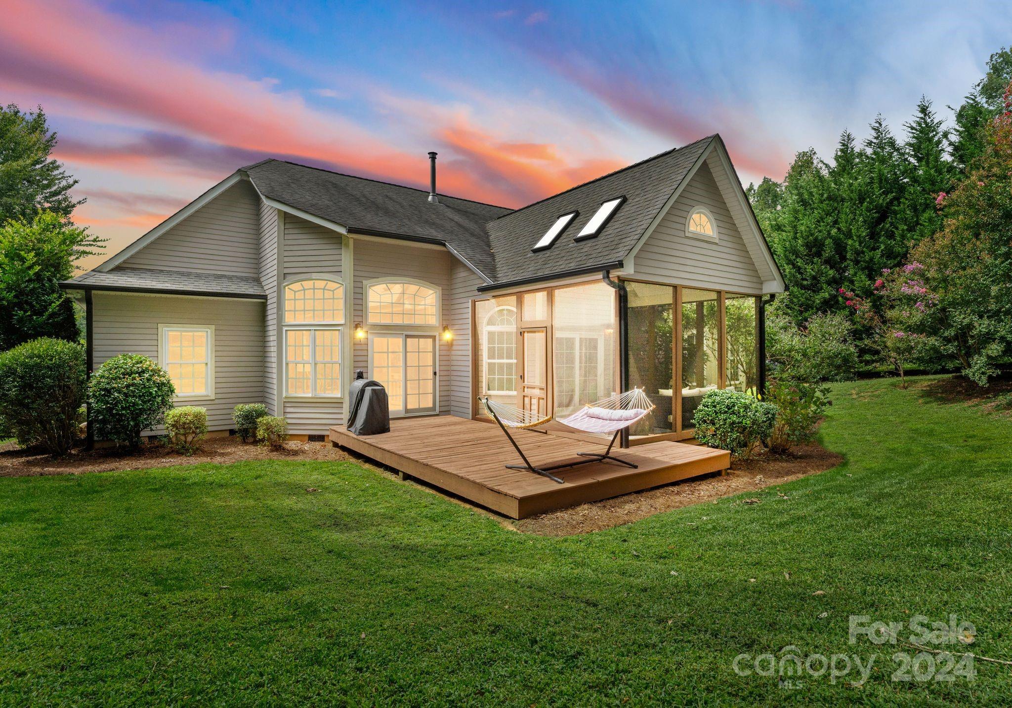 687 Normandy Road Mooresville, NC 28117 - Photo 2 of 32 a front view of house with a garden and patio